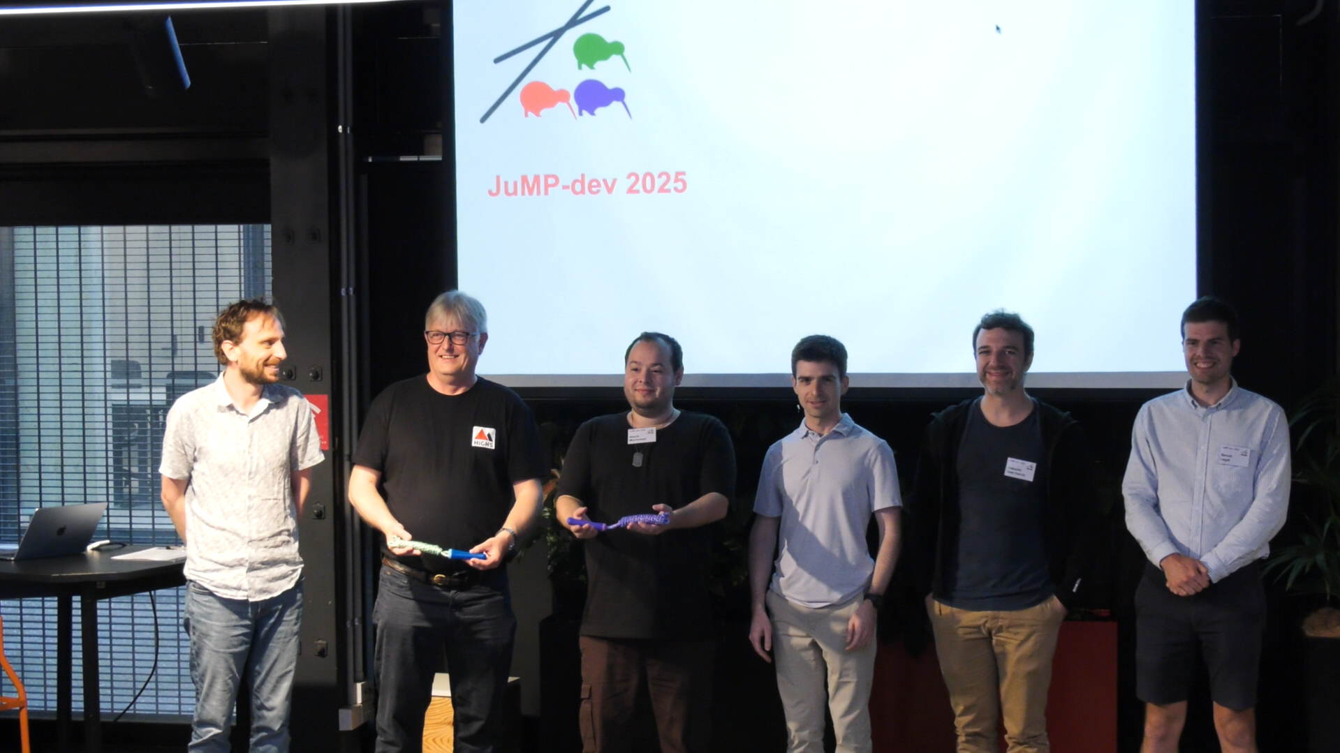Photo of winning presenters of JuMP-dev 2025